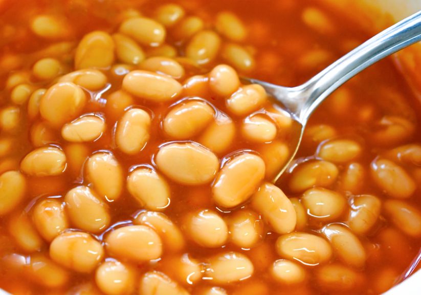 A close up of baked beans in tomato sauce