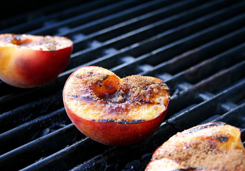 Grilled peaches on a barbecue