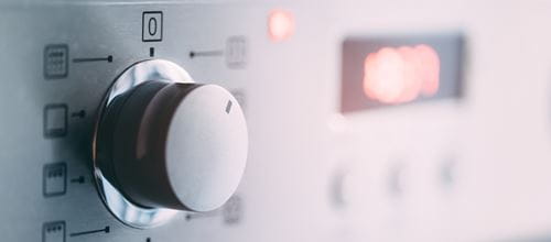 Close up of washing machine switched on