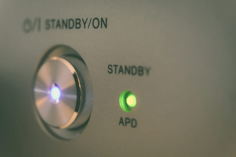 A device with the green standby light on