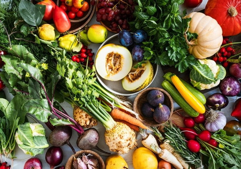 a spread of autumn fruit and vegetables