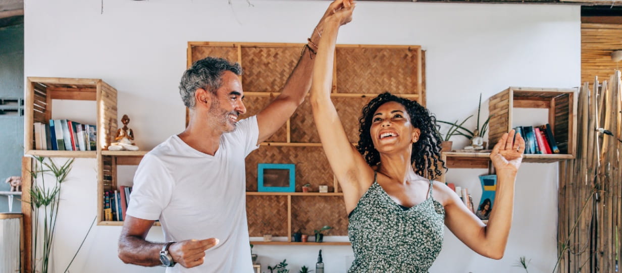 Older couple dancing in the lounge