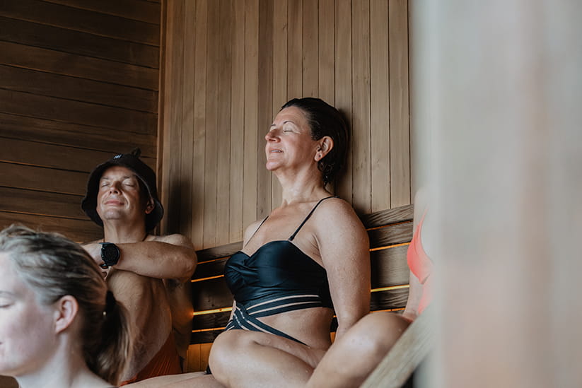 A woman sat in a sauna