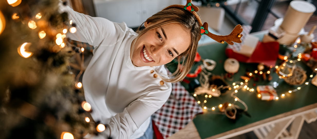 Woman decorating Christmas tree