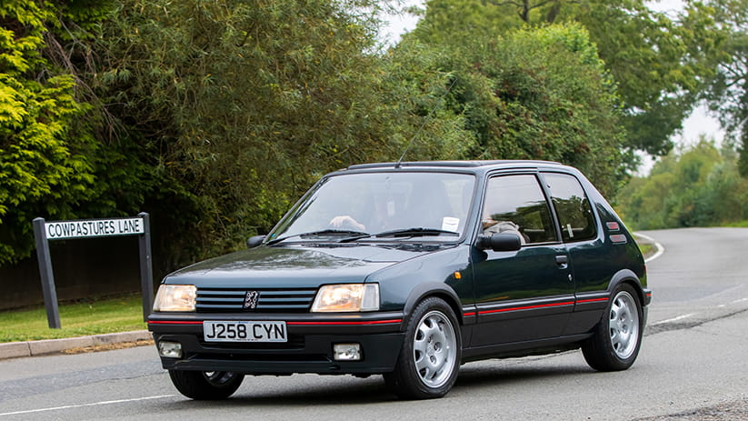 A dark grey Peugeot 205 GTi