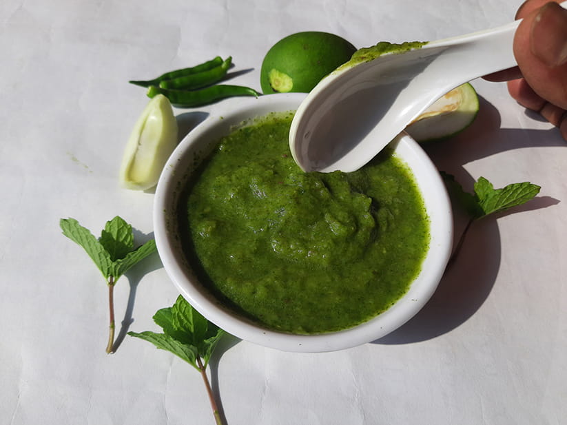 Mint chutney in a small bowl