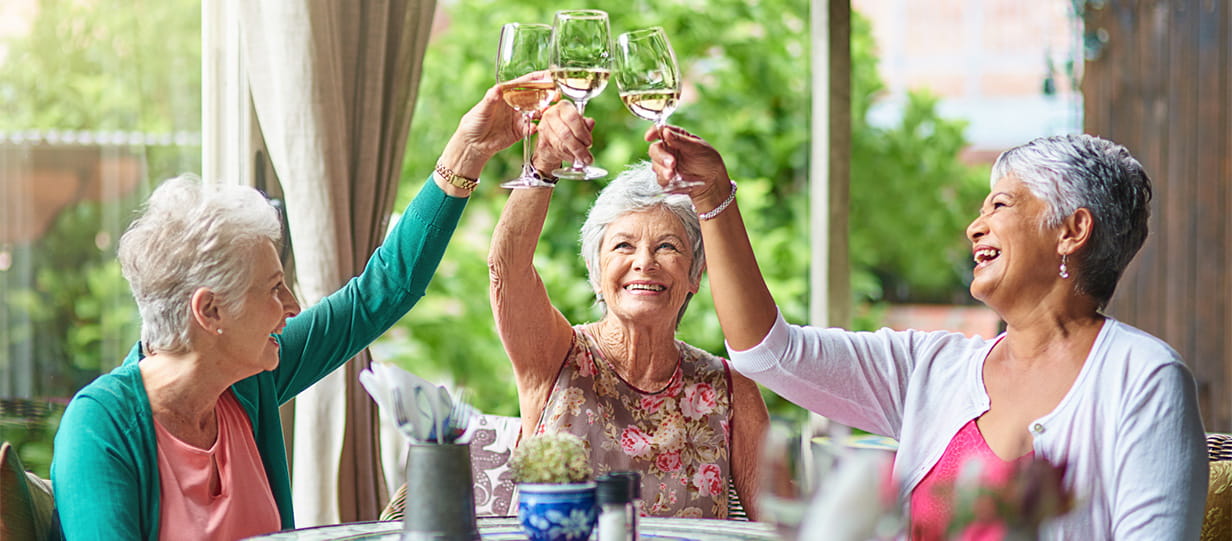 Three women toasting with alcohol-free wine