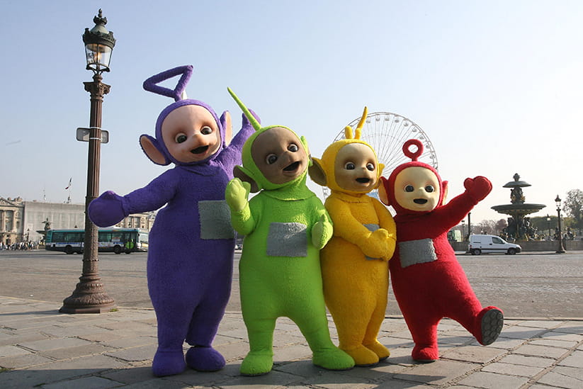 The Teletubbies posing in front of the London Eye