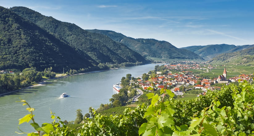 Aerial view of a boat sailing along the Danube River in the Wachau