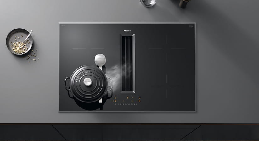 Aerial view of black Miele downdraft extractor hob