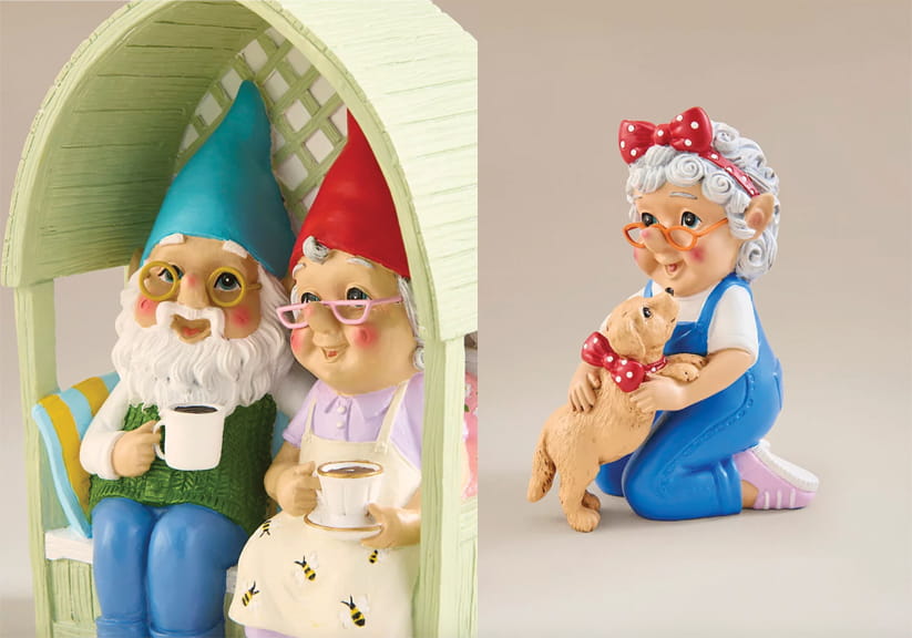 A garden gnome couple in an arbour, and a garden gnome lady hugging a dog