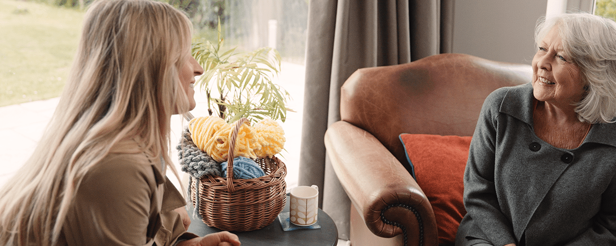 Image of Jean and Emily relaxed and chatting, with no visible technology, emphasising the quality time their new routine allows.