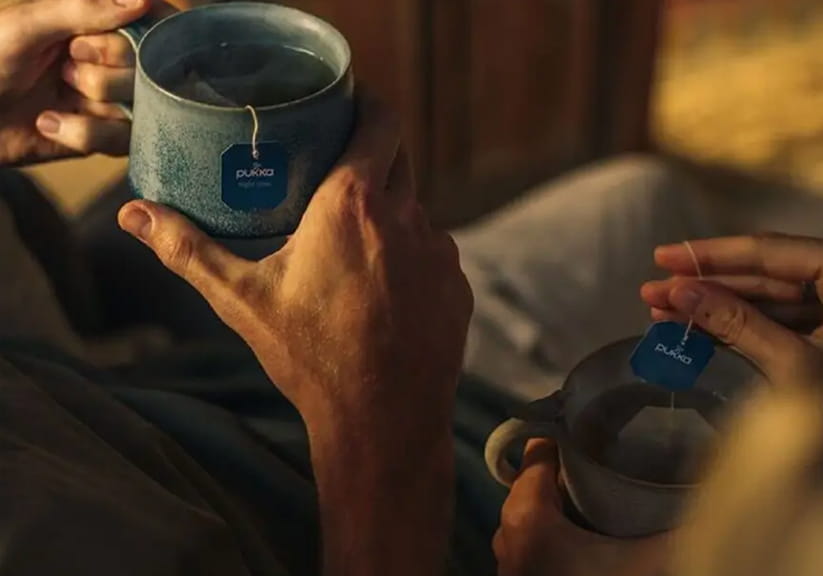 Pukka Night Time Tea in the hands of two older people