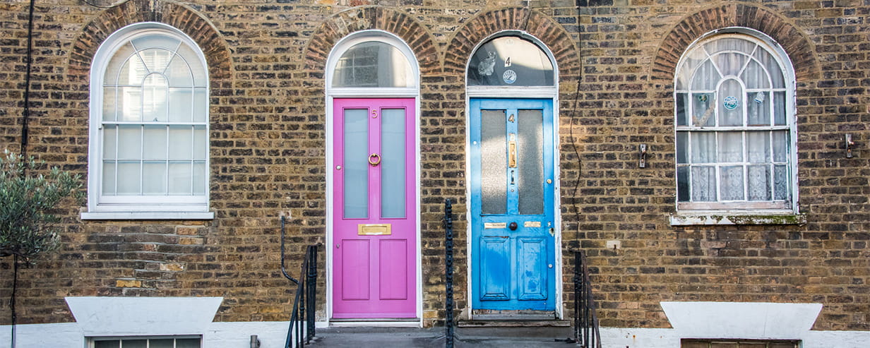 A bright pink and bright blue front door in London