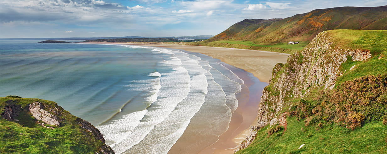 A scenic view of Rhossili Bay in South Wales