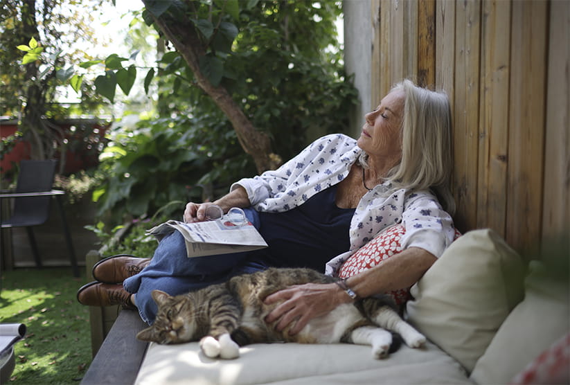 Portrait of an elderly woman taking a nap on her terrace