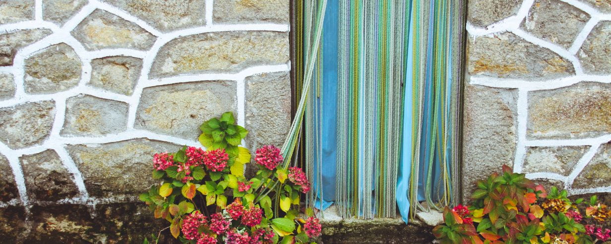 A striped curtain to keep flies out of the house