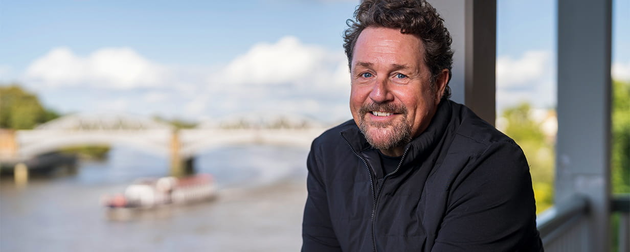 Michael Ball photoshoot in front of a bridge