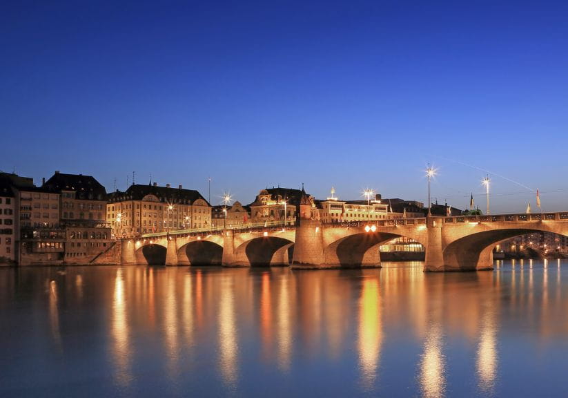An illuminated bridge over the Rhine at Basel at night