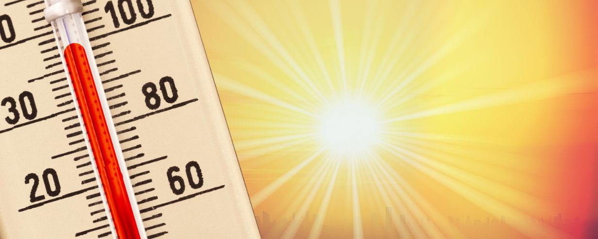 hot thermometer with blinding sun next to it 