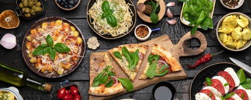 A massive dinner table with a combination of different foods
