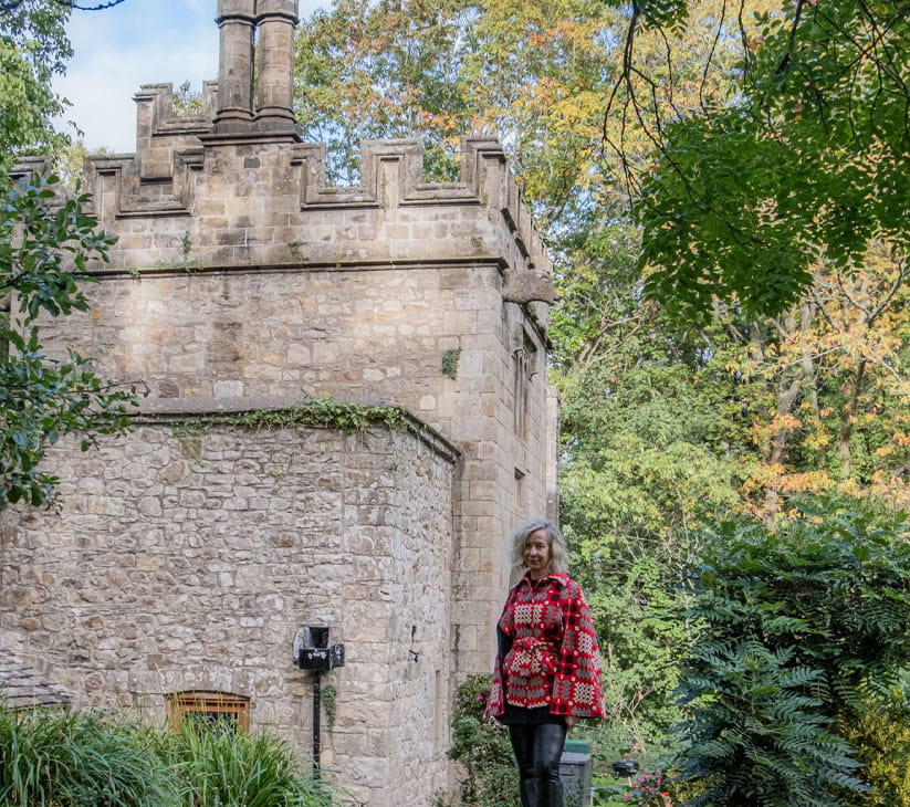 Phillipa Cherryson in the garden with the exterior walls of the gatehouse