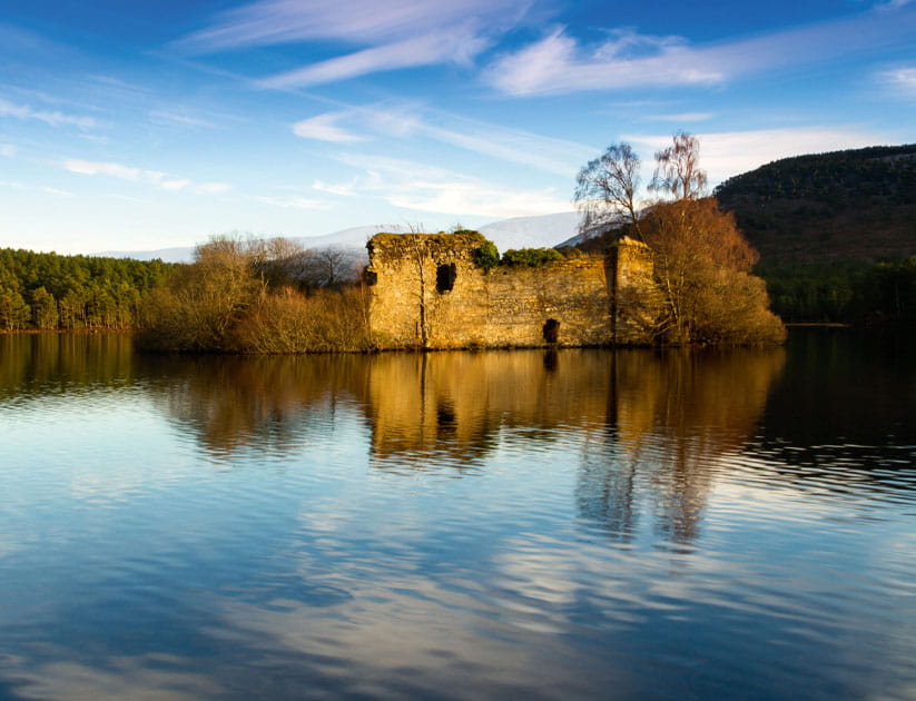 View of Loch an Eilein with ruined 13th-century castle on an island in a loch