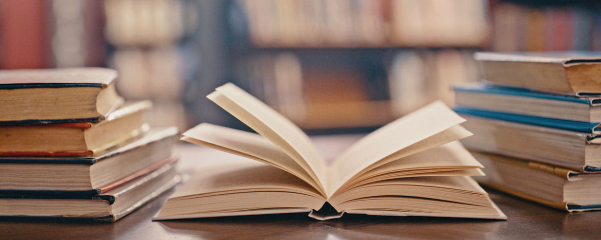 books on table and background for studying, learning and research in education, school or college