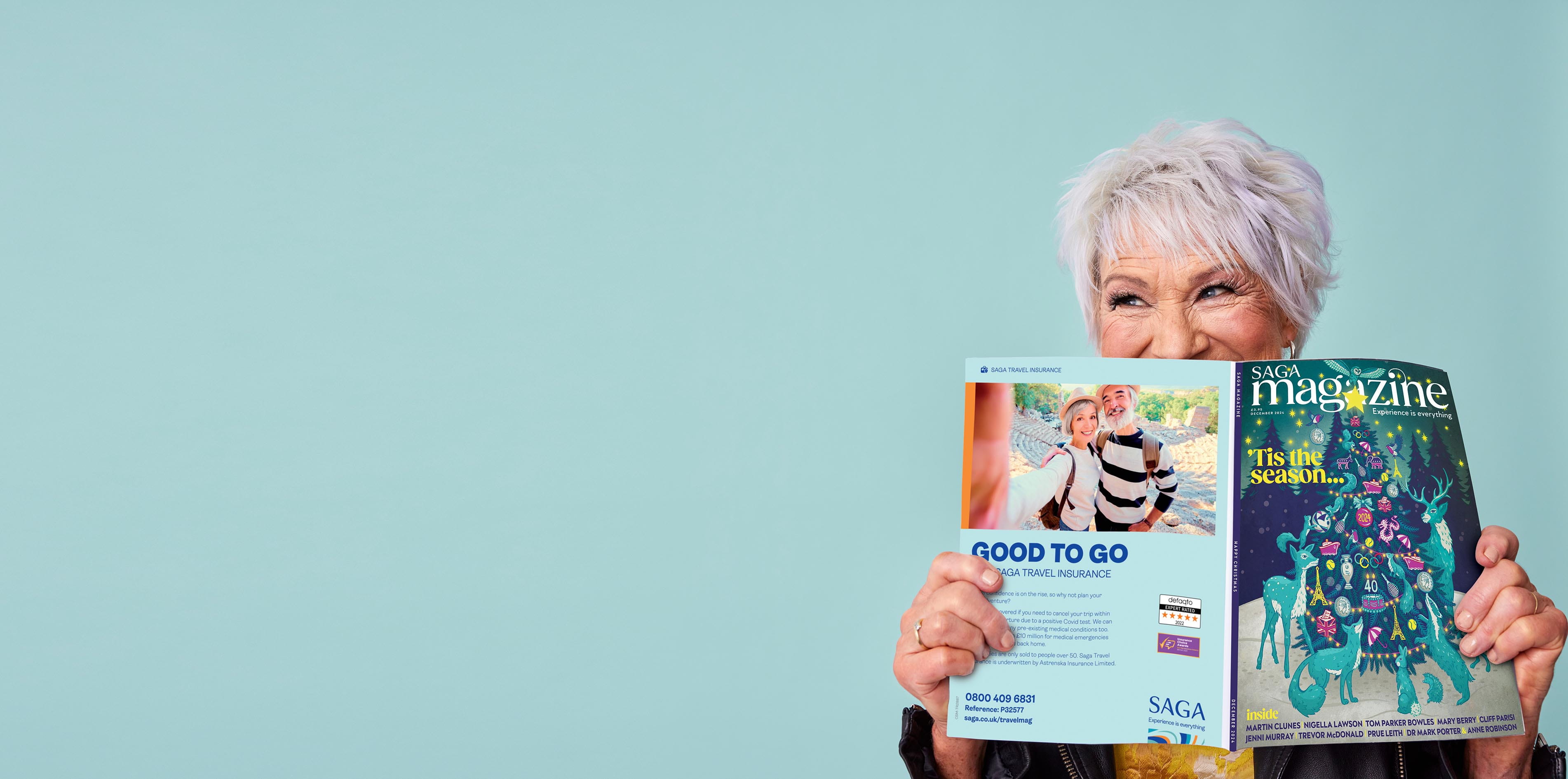 Older person looking over the top of a print magazine