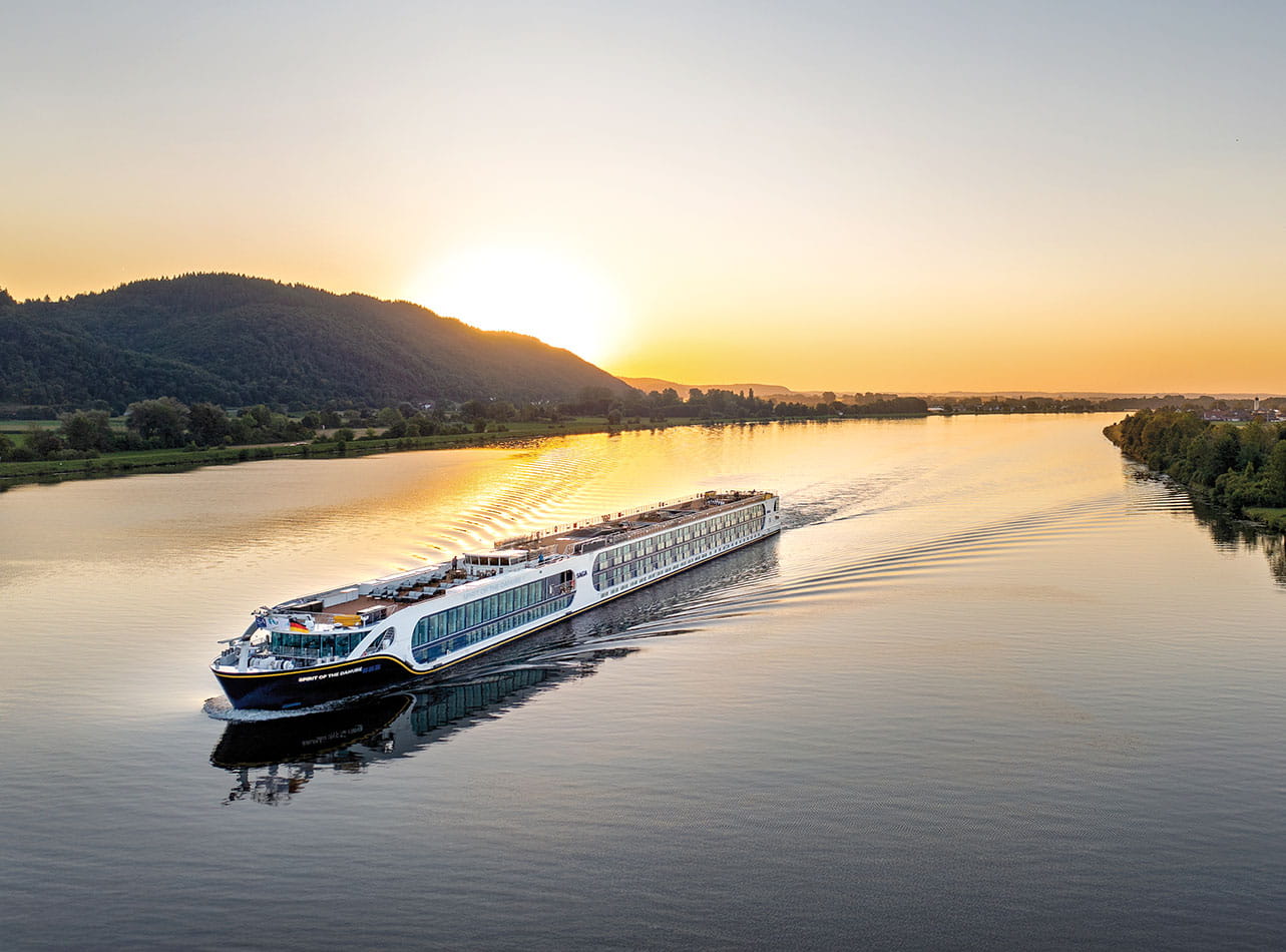 One of Saga's river cruise ships sailing down a river