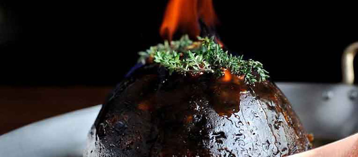 A Christmas pudding with a flaming top