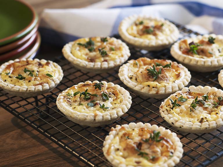 Mini quiches on a baking rack
