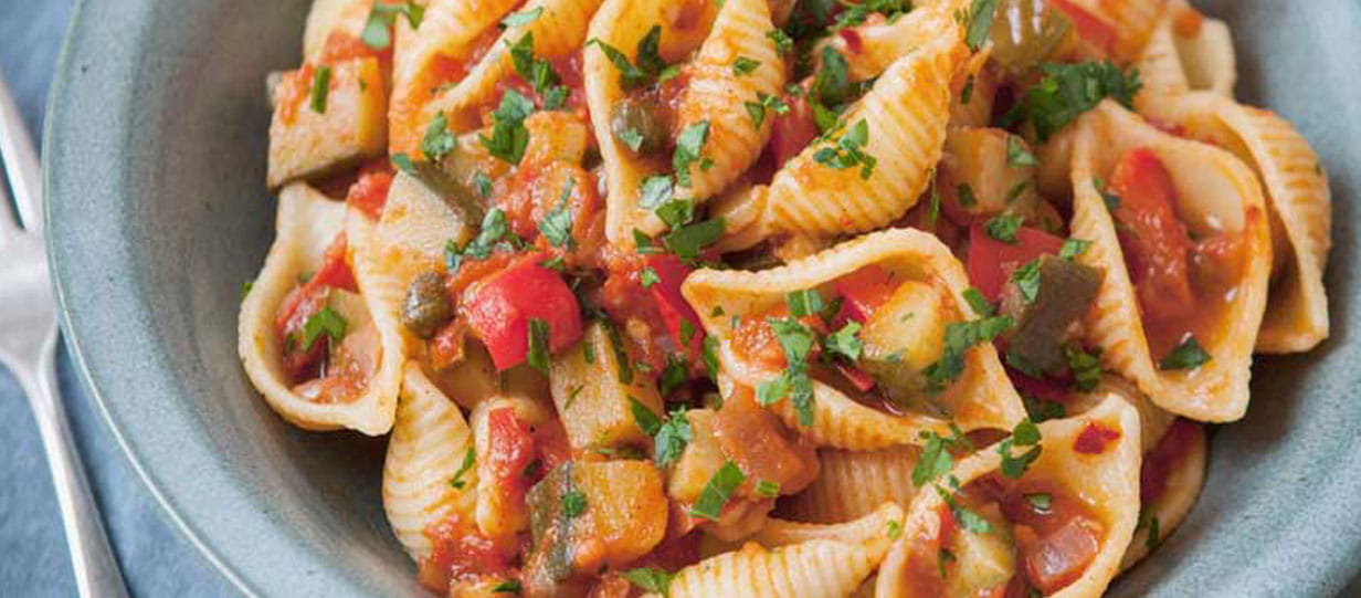 close up of a bowl of The Hairy Bikers courgette caponata pasta