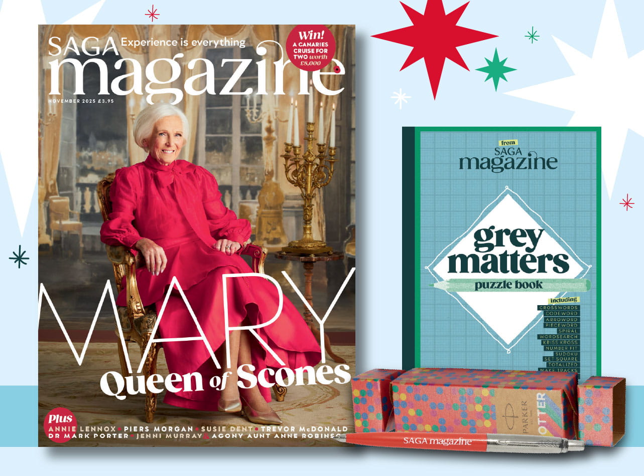 A print magazine, a puzzle book and a parker jotter pen in front of a Christmas cracker
