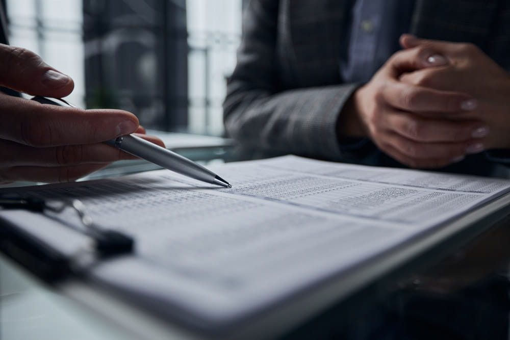 Paperwork being explained and shown to someone