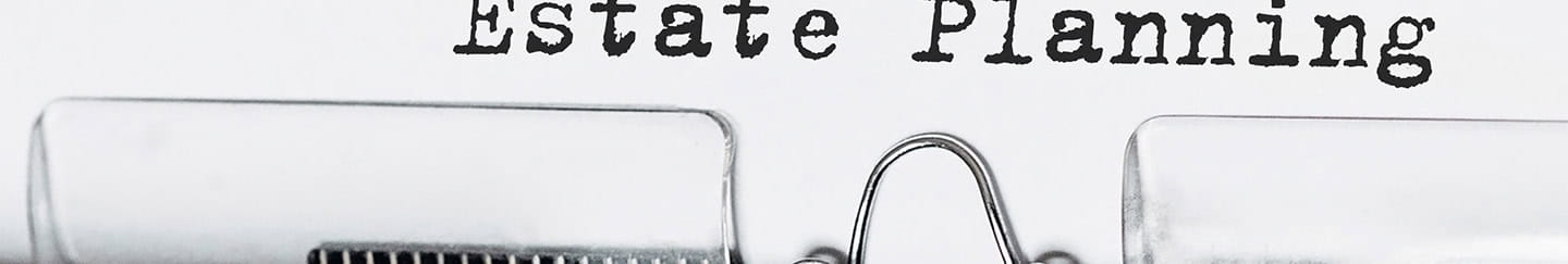 A typewriter with estate planning typed on a piece of paper
