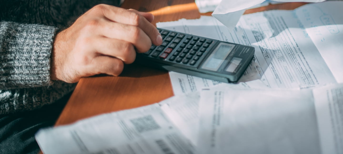 A man using a calculator 