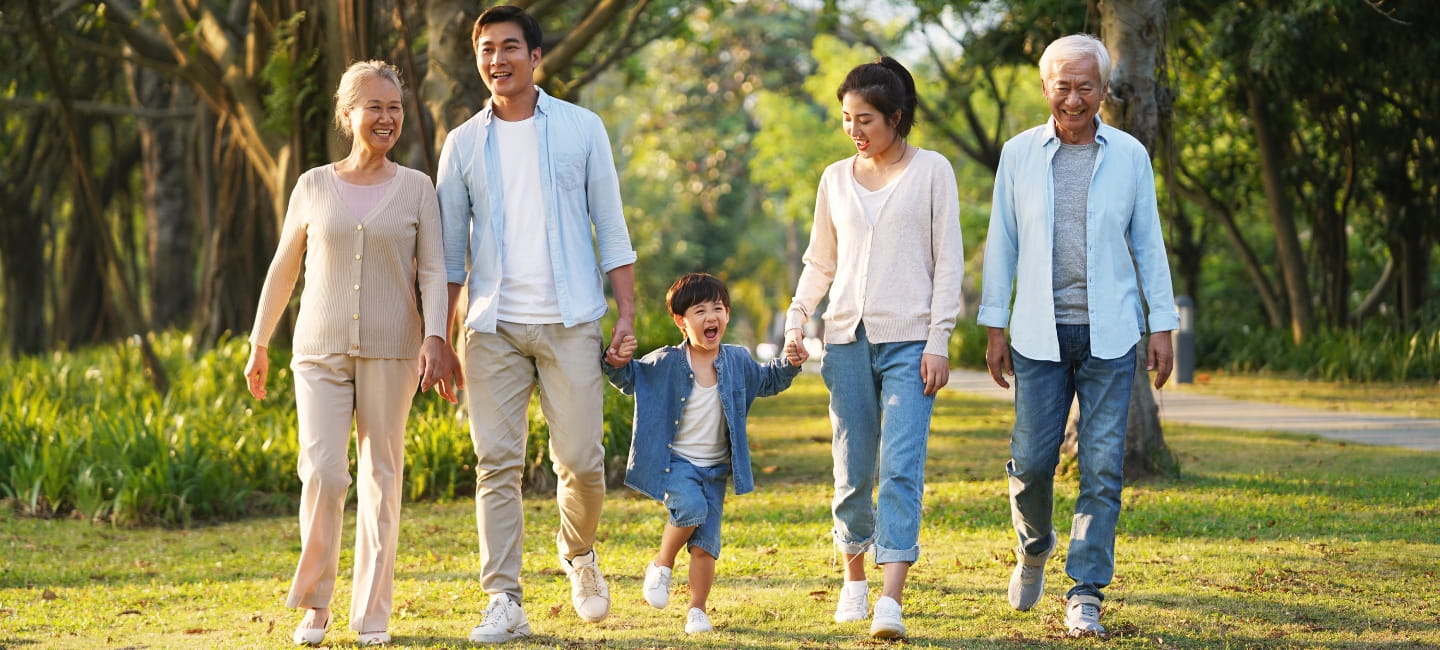 Grandparents walking with their children and grandchild