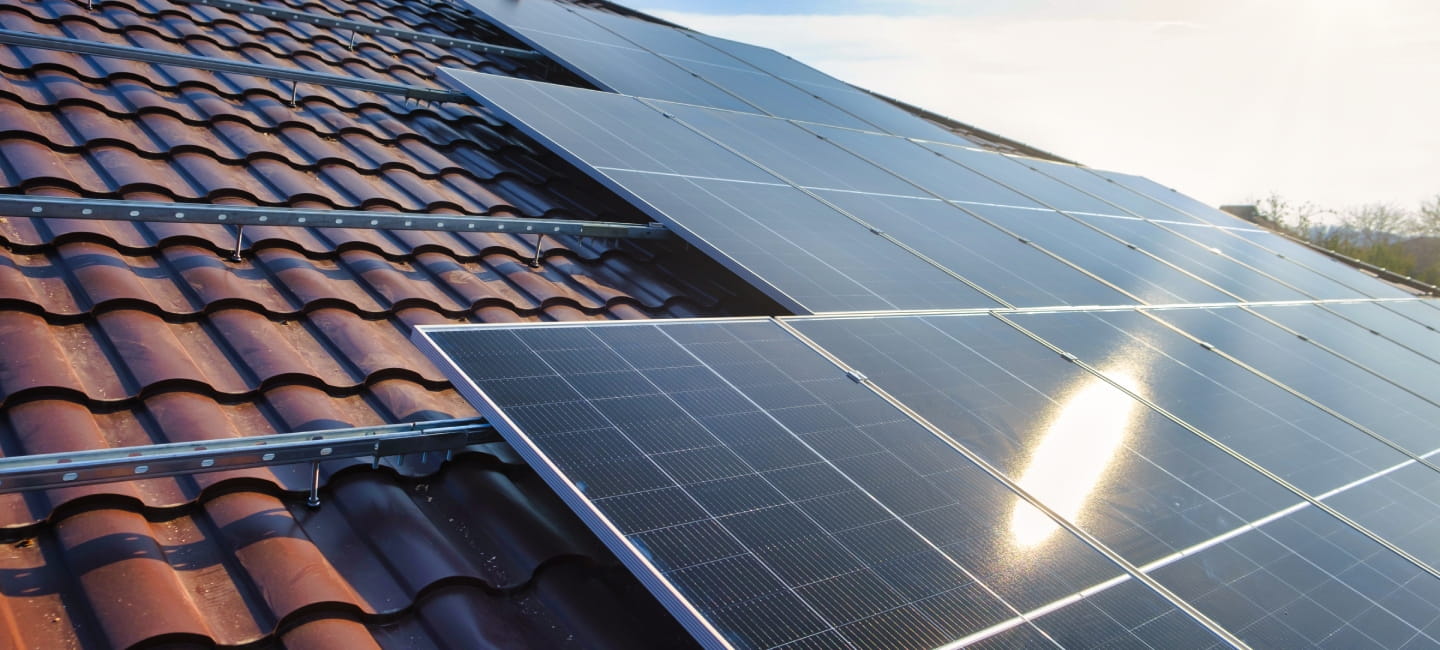Photovoltaic panels on the roof . Roof Of Solar Panels. View of solar panels (solar cell) in the roof house with sunlight