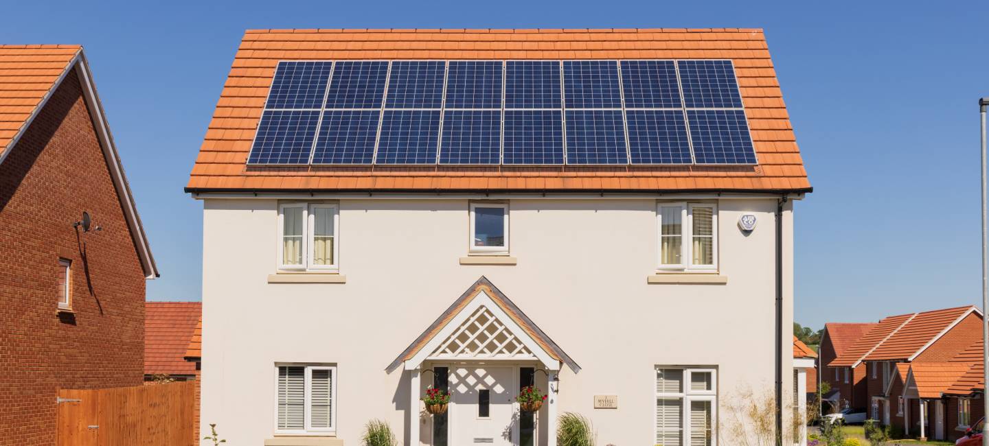 Detached new build home with solar panels on the roof