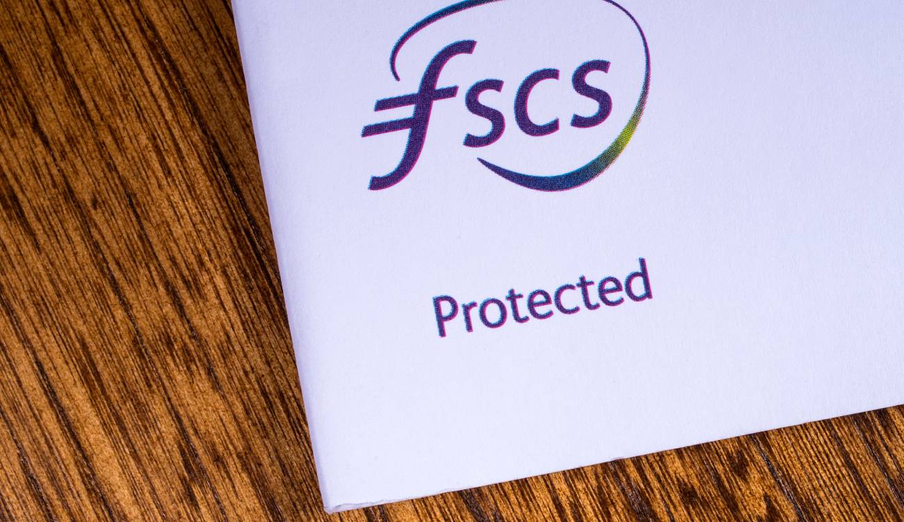  A close-up of the FSCS - Financial Services Compensation Scheme logo, pictured on an information leaflet.