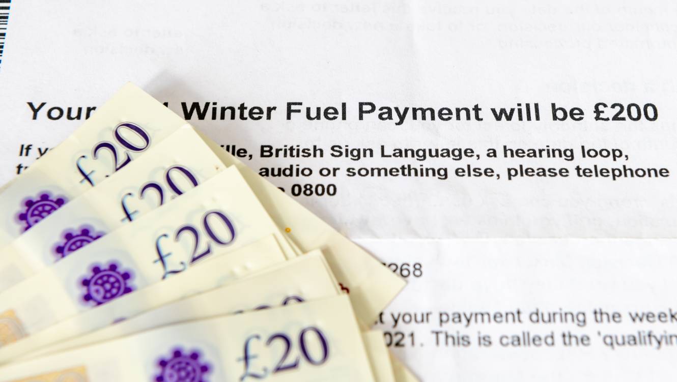 A winter fuel letter with 5 £20 notes resting on the letter