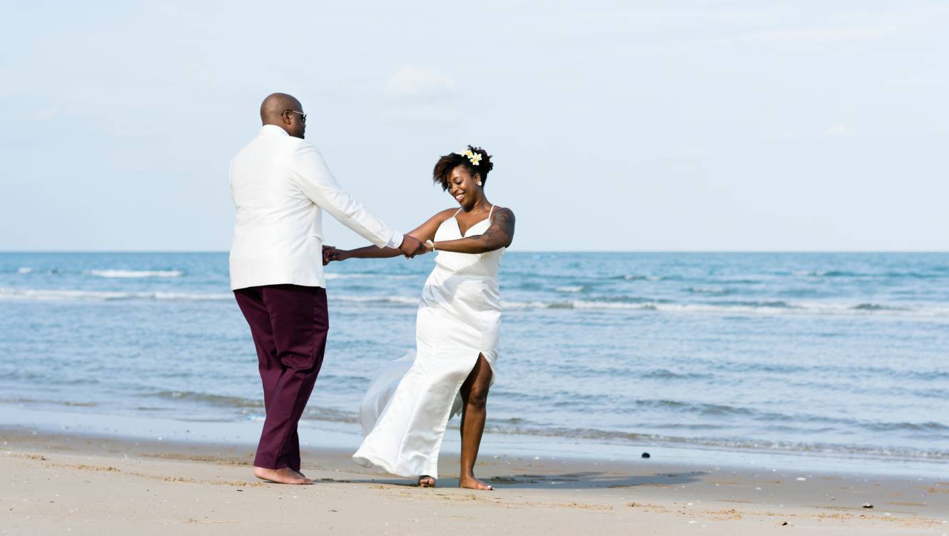African American couple getting married at an island