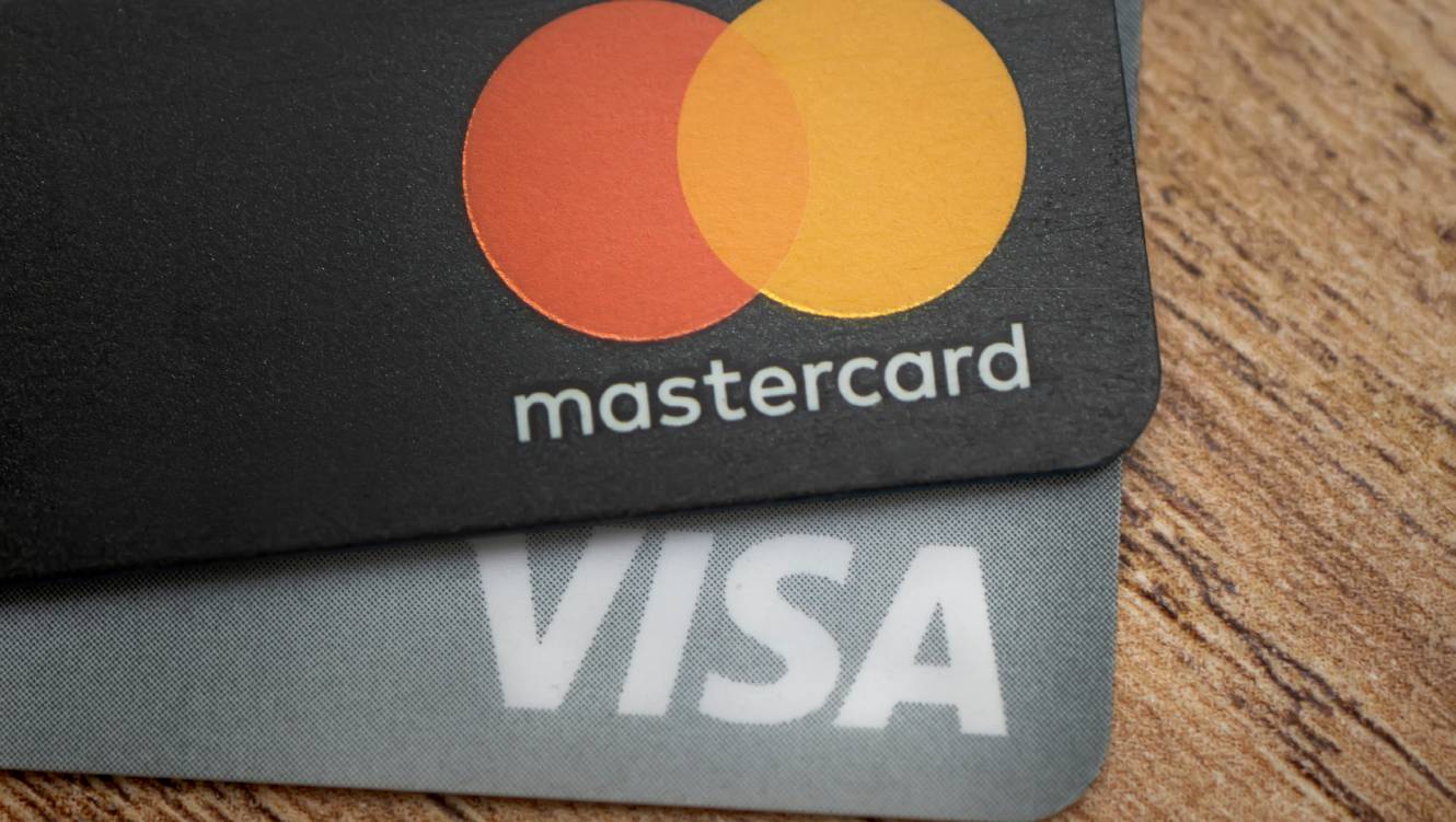  Close up of a pile of mastercard credit load debit bank cards.