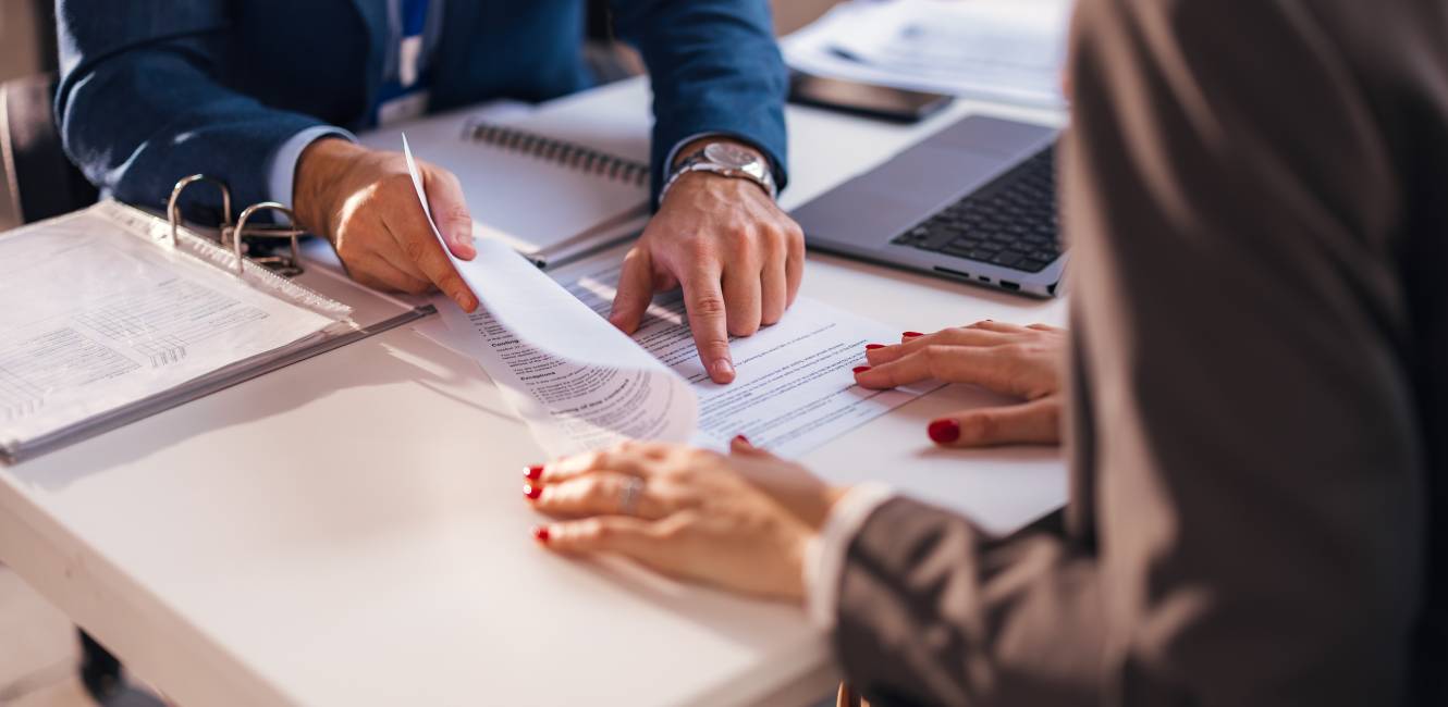 An Accountant with the client and they sign the contract.