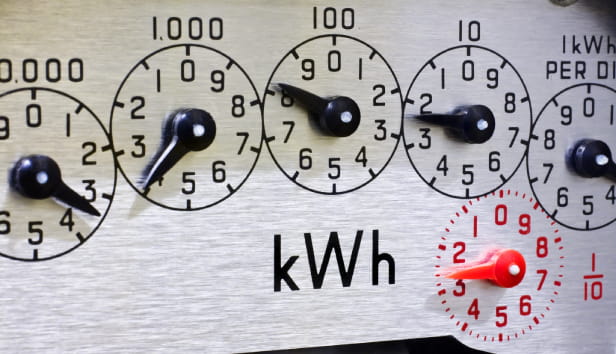 Electric Meter Dials close-up. Concept for cost of living, price rises, inflation, heating the home, meter reading and winter fuel allowance.