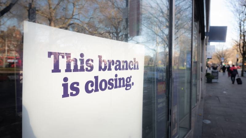 A shop window with the sign 'This branch is closing' 