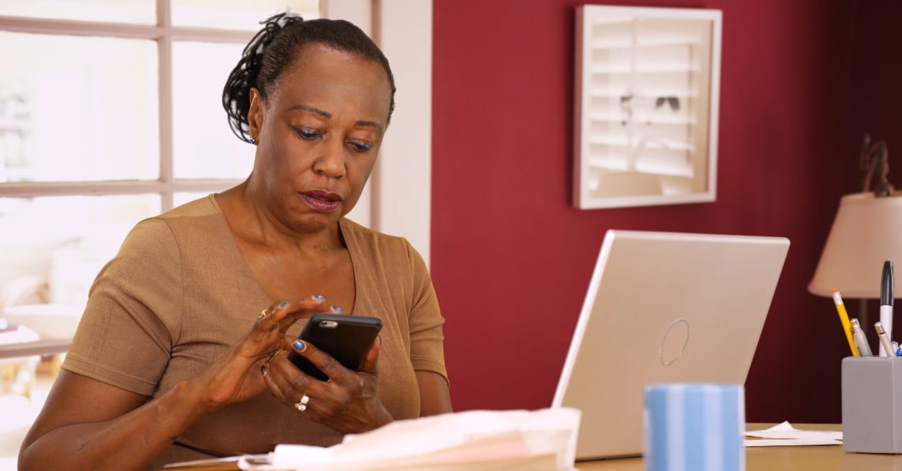 A lady at a desk with her laptop