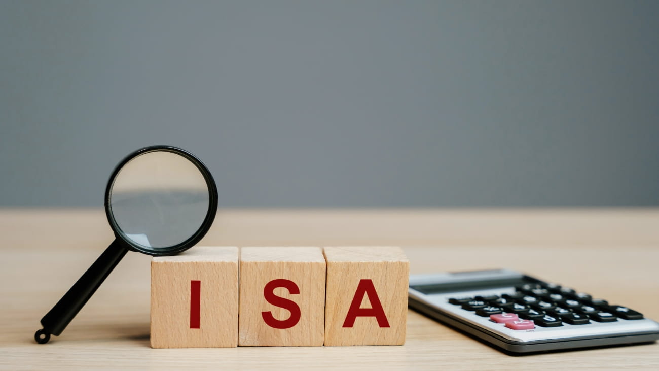 ISA - Individual Savings Account on a wooden blocks. Class of retail investment arrangement available to residents of the United Kingdom. Business and finance concept