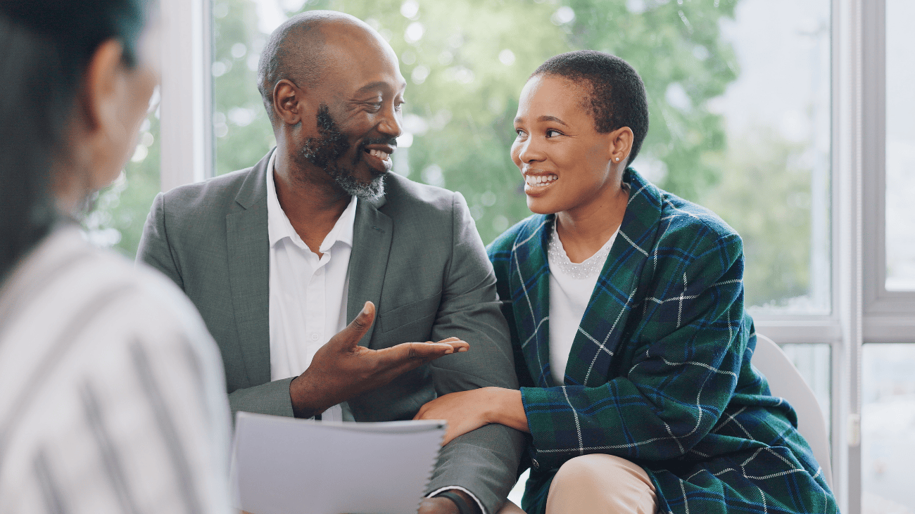 Couple speaking with a tax advisor